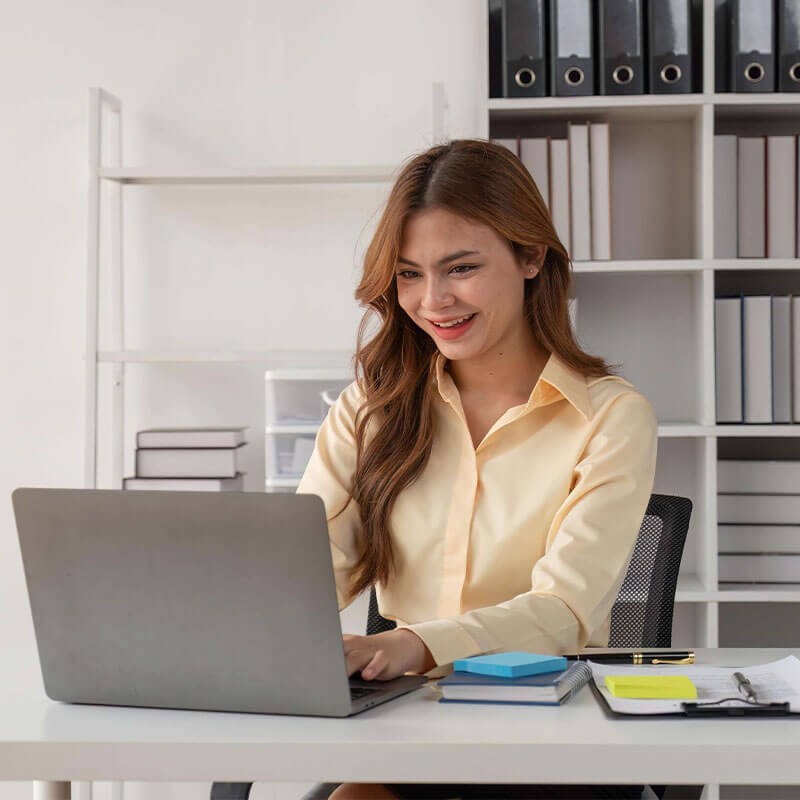 Smiling Adult Woman on computer